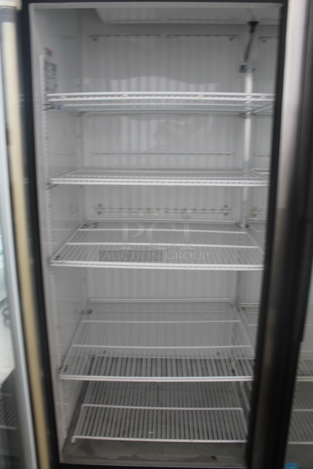 2011 True GDM-49F ENERGY STAR Metal Commercial 2 Door Reach In Freezer Merchandiser w/ Poly Coated Racks on Commercial Casters. 115/208-230 Volts, 1 Phase.  - Image 4 of 8