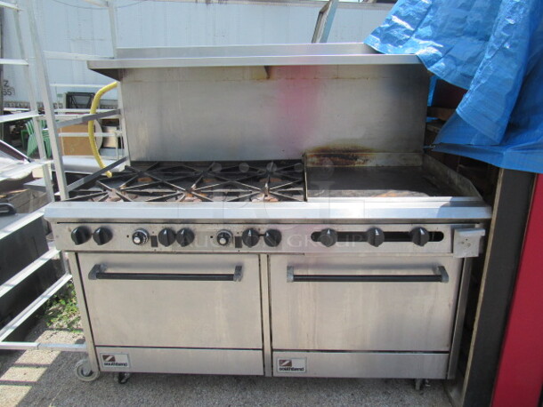 One Stainless Steel Southbend Natural Gas 6 Burner/Griddle Range With Stainless Overshelf, On Casters. 61X33X58