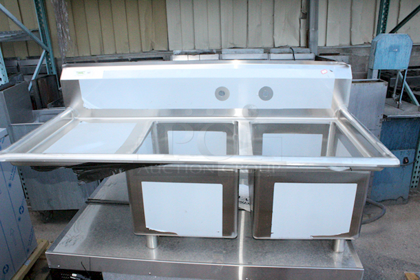 BRAND NEW SCRATCH & DENT! Regency 600S2162018L 54 1/2" 16 Gauge Stainless Steel Two Compartment Commercial Sink With 1 Drainboard - 16" x 20" x 12" Bowls - Image 1 of 7