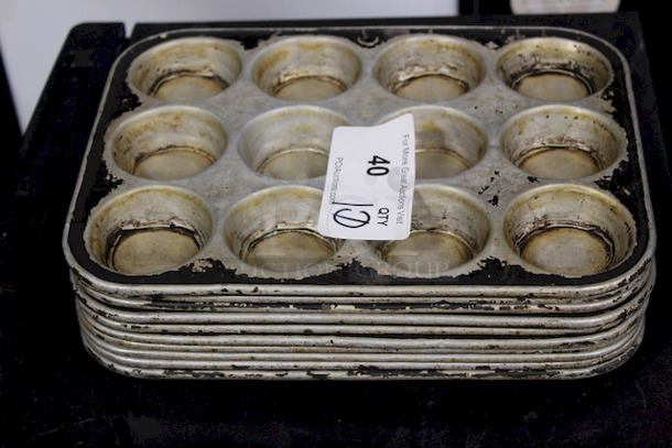 AWESOME! 12 Hole Muffin Pans. Muffin Hole Measurements 2-1/2”x1”. OA 13x10x1 10x Your Bid - Image 1 of 1