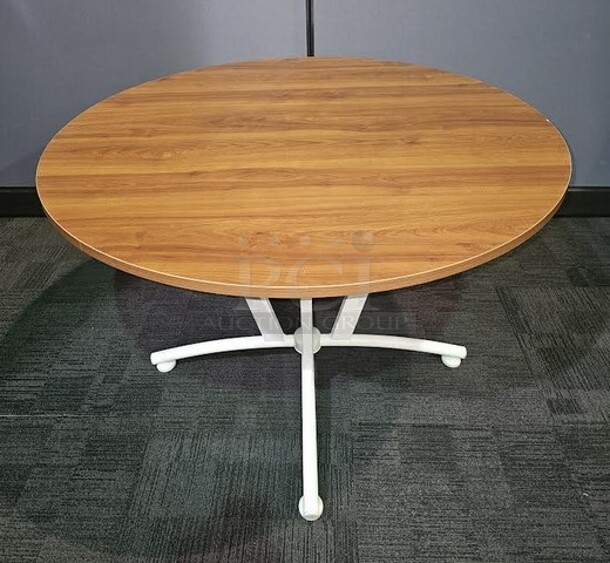 Linea Italia by Crisa brand table. Has a white metal base and oak wooden top. Made in Mexico. Measures 29” H x 43” D.  - Image 1 of 2
