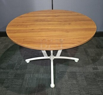 Linea Italia by Crisa brand table. Has a white metal base and oak wooden top. Made in Mexico. Measures 29” H x 43” D. 