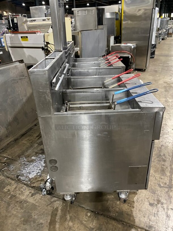 GREAT! Pitco Frialator 4 Bay Natural Gas Powered Commercial Deep Fat Fryer! With Middle Dump Station! With 8 Frying Baskets! With Oil Filter System! All Stainless Steel! MODEL: SGH50 SN: G11BD005229! 115V! On Casters! Working When Removed!  - Image 3 of 12