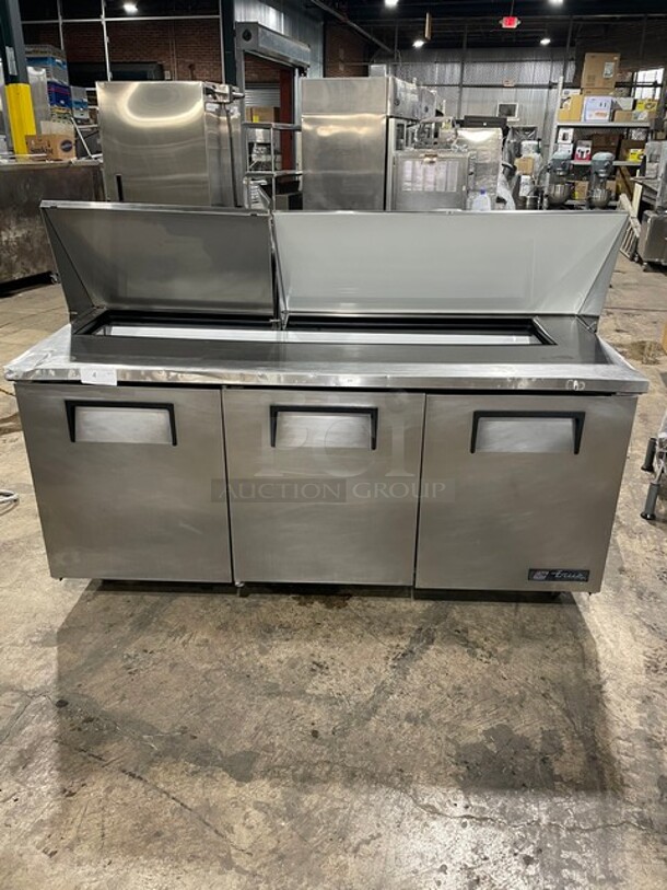 True Mega Top Sandwich/Salad Prep Table! All Stainless Steel! With 3 Door Refrigerated Storage Underneath! With poly Coated Racks! 115V 1 Phase! On Casters! Model: TSSU-72-18 SN: 1-4477571!  - Image 5 of 11