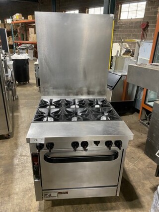 Southbend Commercial Natural Gas Powered 6 Burner Stove! With Raised Back Splash! With Oven Underneath! All Stainless Steel! On Casters!