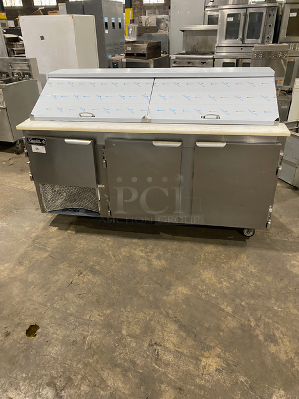 Leader Commercial Refrigerated Sandwich Prep Table! With Commercial Cutting Board! With 3 Door Storage Space Underneath! All Stainless Steel! On Casters! Model: LM72S/C SN: GX03S1112 115V 60HZ 1 Phase