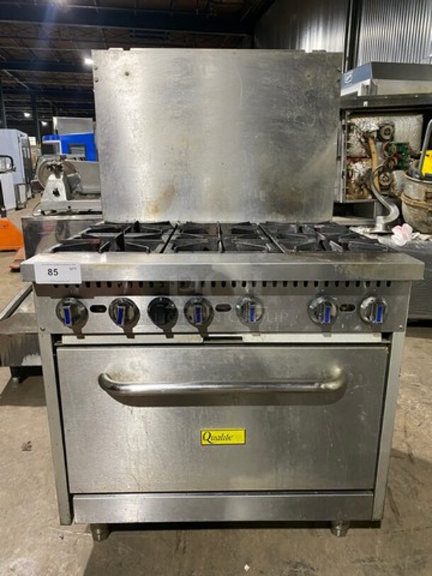 Great! LATE MODEL! Qualite Commercial Natural Gas Powered 6 Burner Stove! With Raised Back Splash! With Oven Underneath! Stainless Steel Body! On Legs! Model: QLGR36 SN: 17085000030! Working When Removed!
