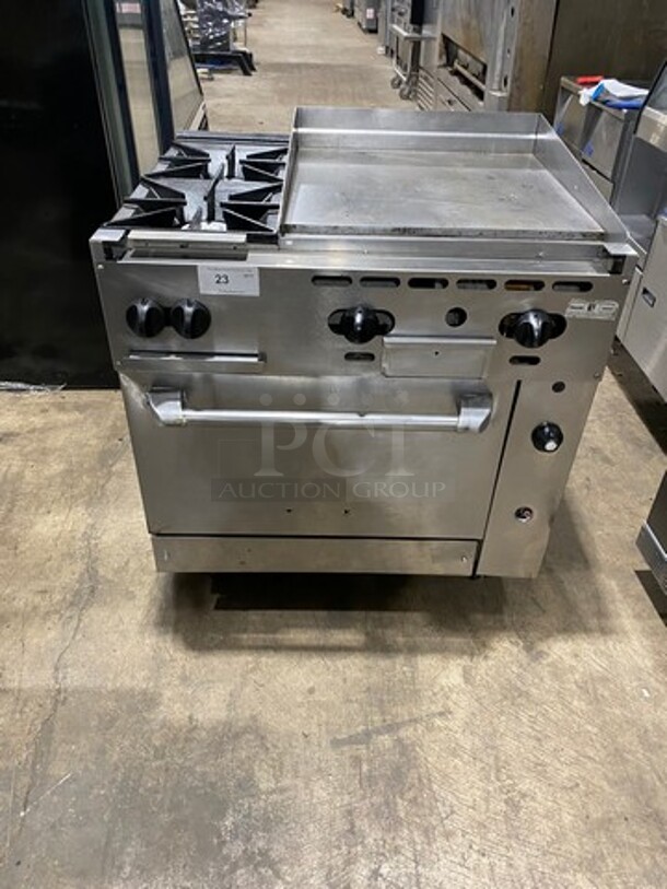 WOW! Vulcan Commercial Natural Gas Powered 2 Burner Stove With Flat Griddle! Flat Griddle Has Back And Side Splashes! With Oven Underneath! All Stainless Steel! On Casters! Model: 36S2B24GN SN: 481883161