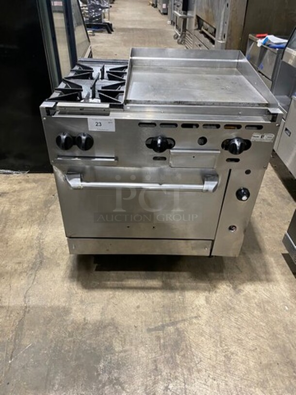WOW! Vulcan Commercial Natural Gas Powered 2 Burner Stove With Flat Griddle! Flat Griddle Has Back And Side Splashes! With Oven Underneath! All Stainless Steel! On Casters! Model: 36S2B24GN SN: 481883161 - Image 1 of 10