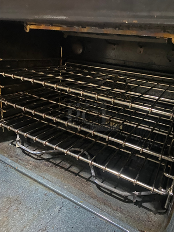 AMAZING! Viking Duel Fuel Powered 4 Burner Stove! With Built In Flat And Ribbed Griddle! With 2 Oven Underneath! Metal Oven Racks! All Stainless Steel! On Legs! - Image 10 of 12