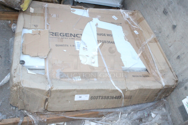 BRAND NEW SCRATCH & DENT! Regency 600TSSB3648S Spec Line 36" x 48" 14 Gauge Stainless Steel Commercial Work Table with 4" Backsplash and Undershelf. Packing is damaged.  - Image 2 of 3