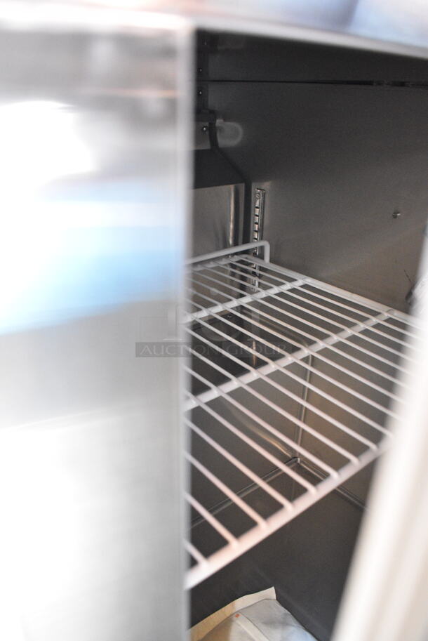 BRAND NEW SCRATCH AND DENT! 2023 Avantco 178SSUC48FHC Stainless Steel Commercial 2 Door Undercounter Freezer. Front 2 Legs are Missing. 115 Volts, 1 Phase. Tested and Working! - Image 4 of 5