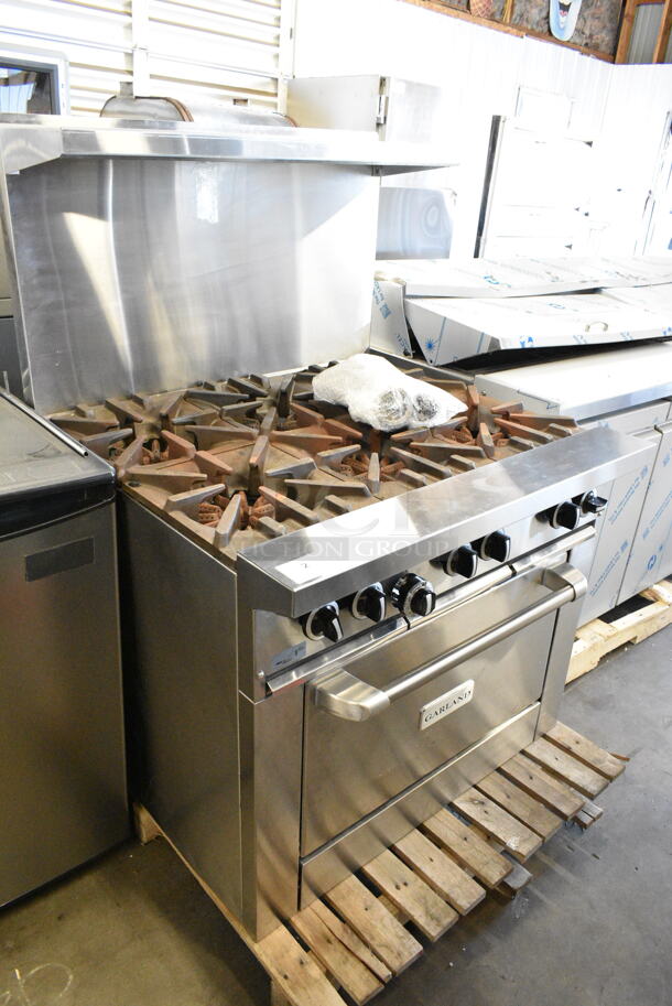 BRAND NEW SCRATCH AND DENT! 2024 Garland G36-6R Stainless Steel Commercial Natural Gas Powered 6 Burner Range w/ Oven, Over Shelf and Back Splash.  - Image 1 of 9