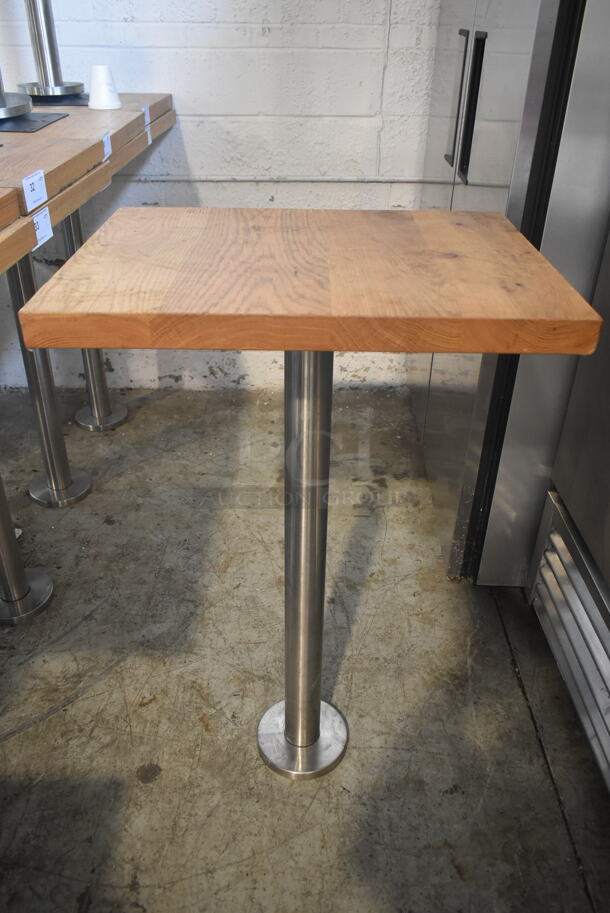 Wooden Butcher Block Bar Height Table on Chrome Finish Metal Table Base. Stock Picture - Cosmetic Condition May Vary.  - Image 1 of 3
