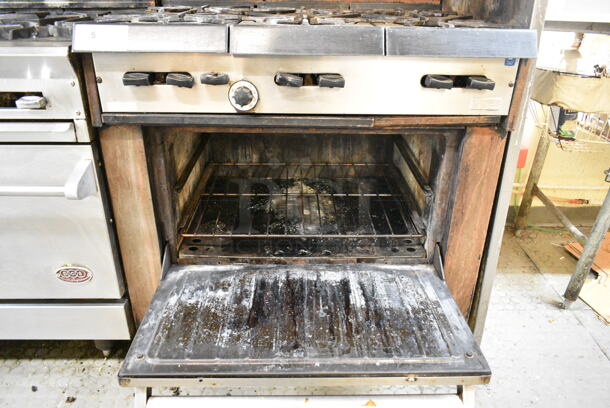 Garland Metal Commercial Natural Gas Powered 6 Burner Range w/ Oven, Over Shelf and Back Splash. This Unit Was In Working Condition When the Restaurant Closed. (kitchen) - Image 2 of 6
