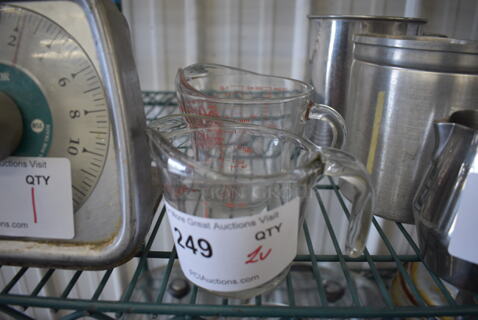 2 Glass Measuring Cups. 5x3.5x4, 6x4.5x4.5. 2 Times Your Bid!