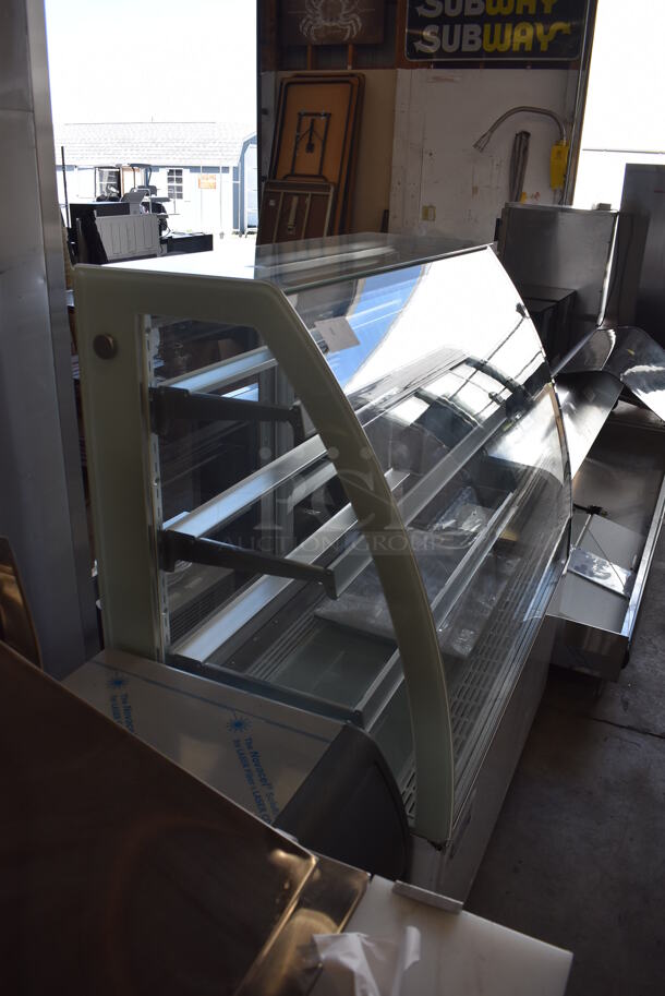 BRAND NEW SCRATCH AND DENT! Avantco 193BCTD48W Stainless Steel Commercial Floor Style 3-Shelf Curved Glass Dry Bakery Display Case w/ LED Lighting on Commercial Casters. 110-120 Volts, 1 Phase. Tested and Working! - Image 3 of 7