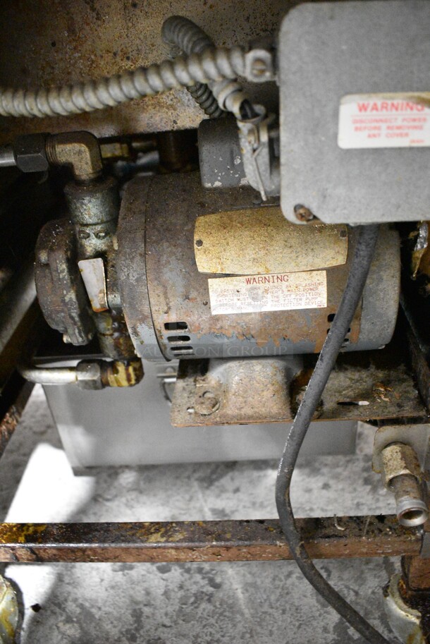 Henny Penny 600 Stainless Steel Commercial Floor Style Natural Gas Powered Pressure Fryer w/ Metal Fry Basket on Commercial Casters. 80,000 BTU.  - Image 9 of 10