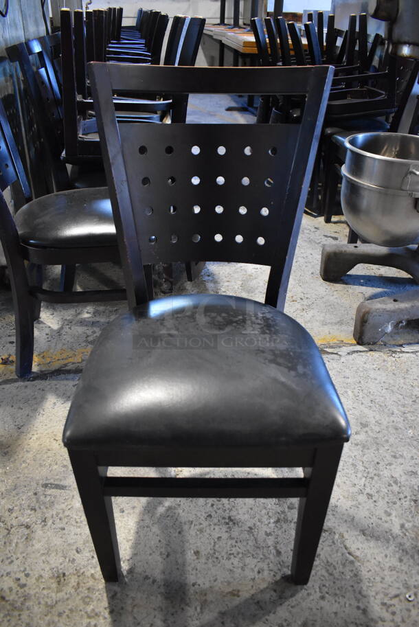 8 Black Wood Pattern Dining Chairs w/ Black Seat Cushion. Stock Picture - Cosmetic Condition May Vary. 17x22x35. 8 Times Your Bid!