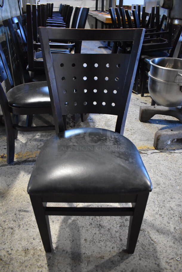 8 Black Wood Pattern Dining Chairs w/ Black Seat Cushion. Stock Picture - Cosmetic Condition May Vary. 17x22x35. 8 Times Your Bid! - Image 1 of 6