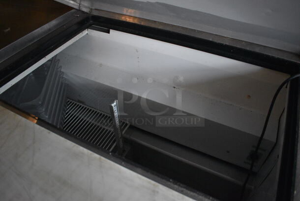 2011 True TSSU-72-30M-B-ST Stainless Steel Commercial Pizza Prep Table on Commercial Casters. BUYER MUST REMOVE. 115 Volts, 1 Phase. 72x34x38. Item Was in Working Condition on Last Day of Business. (Susquehanna Ale House) - Image 3 of 8