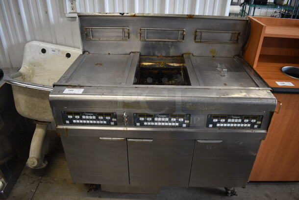 2010 Frymaster Model BIGLA330CSD Stainless Steel Commercial Floor Style Natural Gas Powered 3 Bay Deep Fat Fryer on Commercial Casters. 75,000 BTU. 48x33x48.5