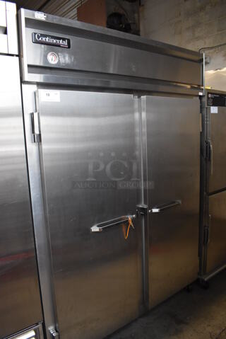 Continental 2FE Stainless Steel Commercial 2 Door Reach In Freezer on Commercial Casters. 115 Volts, 1 Phase. 54x36x82. Tested and Powers On But Temps at 24 Degrees