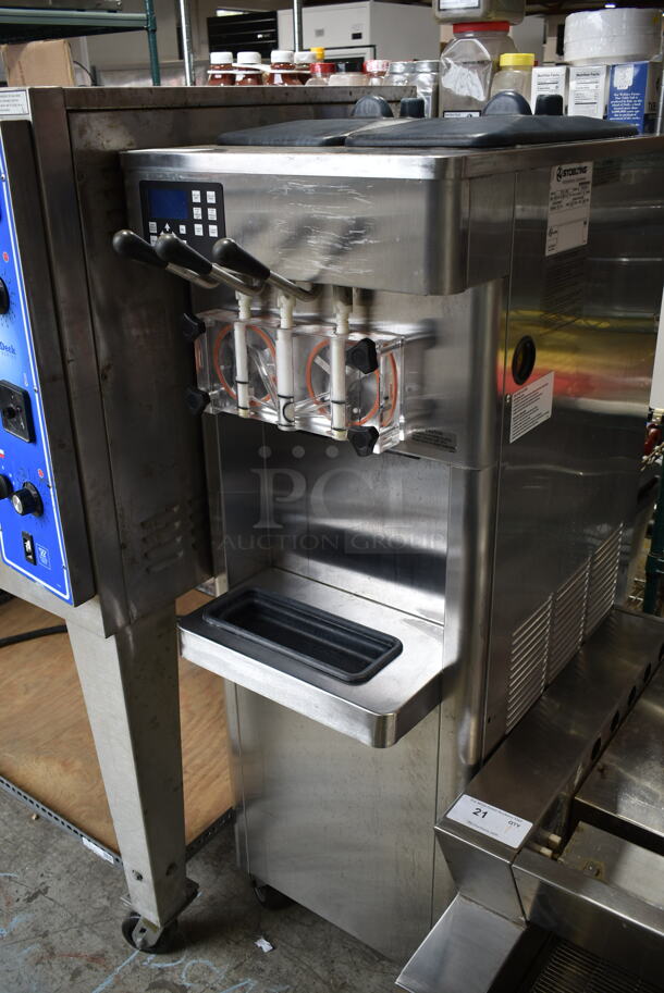 Stoelting F231-38I2 Stainless Steel Commercial Floor Style 2 Flavor w/ Twist Soft Serve Ice Cream Machine on Commercial Casters. 208-240 Volts, 1 Phase. 