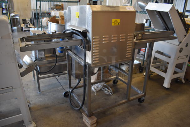 Belshaw Adamatic TG-50 Stainless Steel Commercial Floor Style Thermoglaze Icing Machine on Commercial Casters. Missing 1 Caster. 208 Volts, 1 Phase. 80x34x54