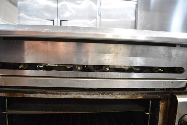 Vulcan V6B36S Stainless Steel Commercial Natural Gas Powered 6 Burner Range w/ Oven on Commercial Casters.  - Image 3 of 6