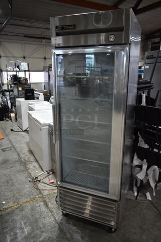 True T-23FG Stainless Steel Commercial Single Door Reach In Cooler Merchandiser w/ Poly Coated Racks on Commercial Casters. 115 Volts, 1 Phase. Tested and Powers On But Does Not Get Cold