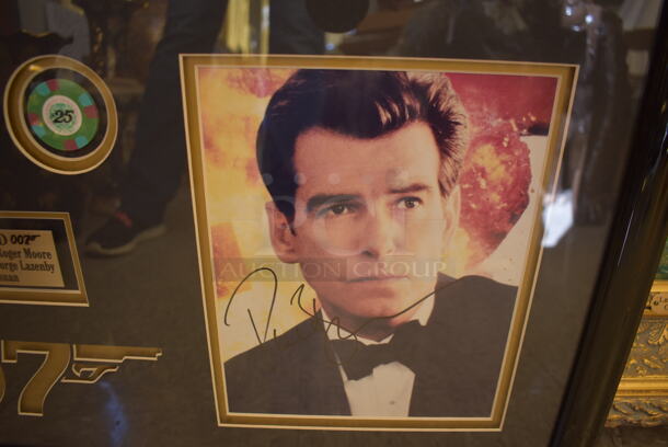 Framed Collage of 5 Autographed James Bonds Actors Including Sean Connery, Roger Moore, Timothy Dalton, Pierce Brosnan, and George Lazenby. Certificate of Authenticity is Attached To Back of Frame. - Image 6 of 9