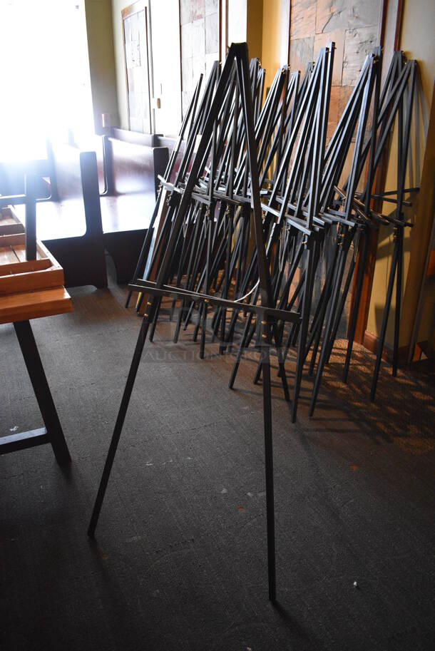 8 Black Easels. BUYER MUST REMOVE. 22x36x64. 8 Times Your Bid! (Susquehanna Ale House) - Image 1 of 3