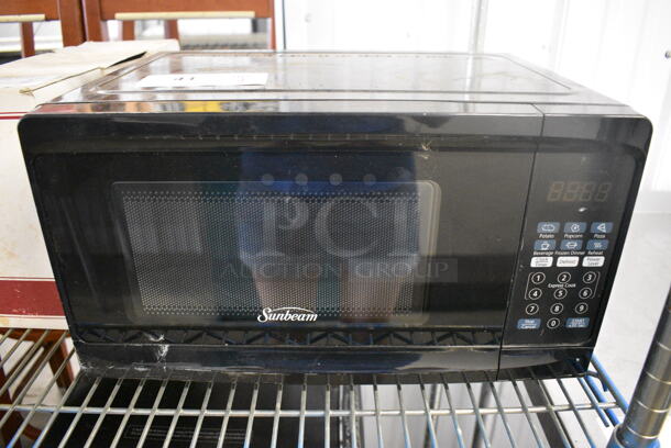 Sunbeam Model SGCMV807BK-07 Metal Countertop Microwave Oven w/ Plate. 120 Volts, 1 Phase. 16.5x12x9.5
