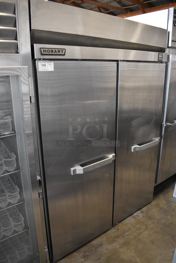 Hobart Q2 Stainless Steel Commercial 2 Door Reach In Cooler w/ Racks. Comes w/ 4 Legs. 120 Volts, 1 Phase. 54.5x35x77. Tested and Powers On But Does Not Get Cold