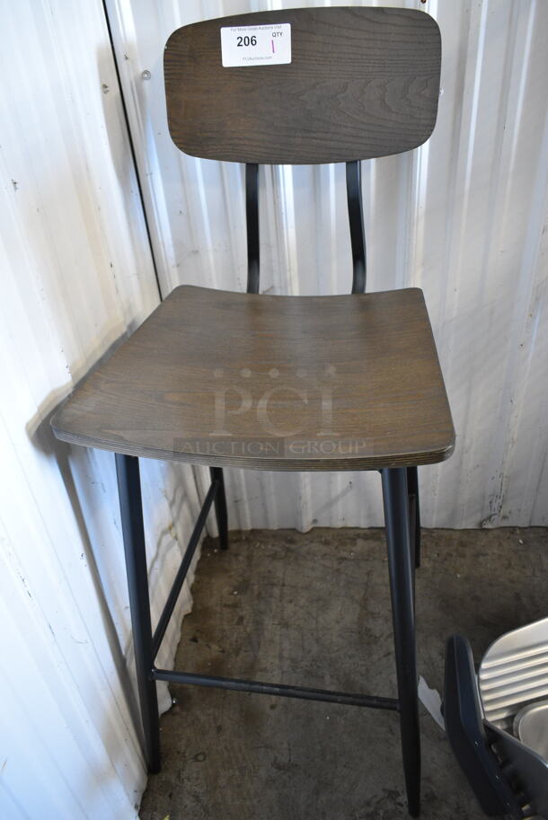 BRAND NEW SCRATCH AND DENT! Black Metal Bar Height Chair w/ Wooden Back Rest and Seat.  - Image 1 of 4