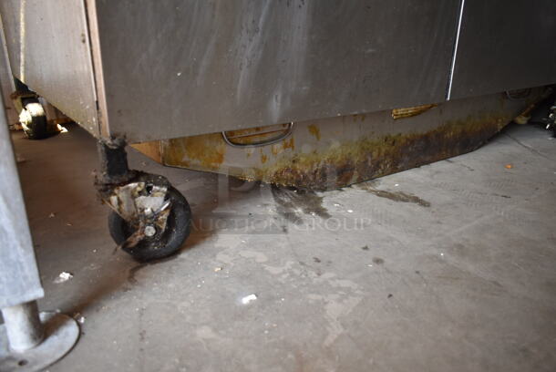 2016 Henny Penny OGA-323 ENERGY STAR Stainless Steel Commercial Natural Gas Powered 3 Bay Fryer w/ 4 Metal Fry Baskets on Commercial Casters. 255,000 BTU.  - Image 4 of 12