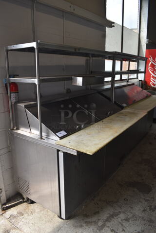 2015 Model True TSSU-60-24M-B-ST Commercial Stainless Steel Sandwich/Salad Prep Table With Overhead Shelving, Steel Pans And Refrigerated Base With Steel Racks. 115V/1 Phase. Tested And Working