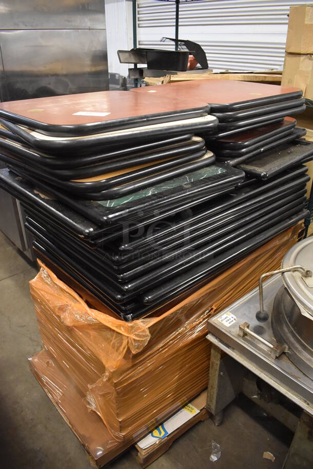 PALLET LOT OF 46 Various Tabletops Including Wood Pattern, Brown w/ Black Rim and Green w/ Black Rim. Includes 46x28x1.5, 24x24x1.5