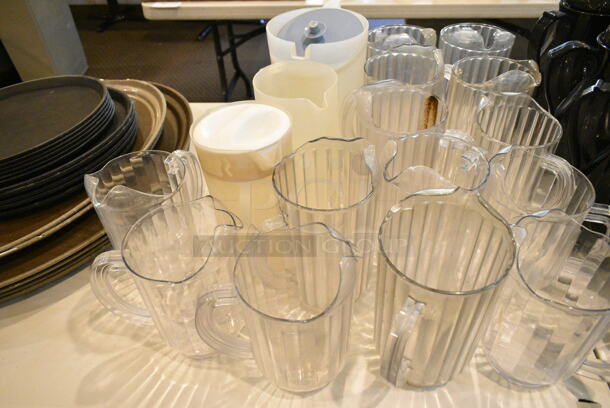 ALL ONE MONEY! Lot of Various Items Including Serving Trays and Poly Pitchers. Does Not Include Table. (main dining room) - Image 3 of 3