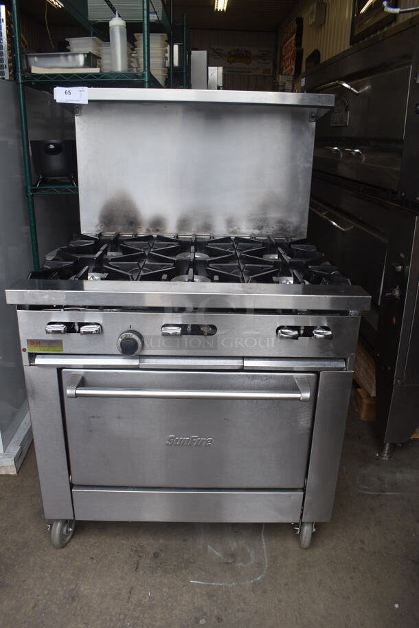 Garland Sunfire Stainless Steel 6 Burner Natural Gas Powered Range with Standard Oven and Salamander Shelf on Commercial Casters