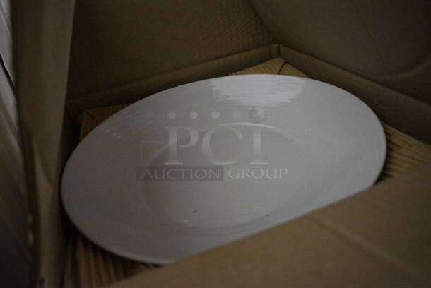 12 BRAND NEW IN BOX! Royal Porcelain Round White Plates. 11x11x1.5. 12 Times Your Bid! - Image 2 of 3