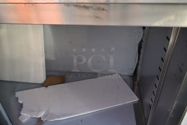 BRAND NEW SCRATCH AND DENT! Regency 600EBTB3072R 30" x 72" 16 Gauge Type 304 Stainless Steel Enclosed Base Sliding Door Table with Drawers and 6" Backsplash - Image 6 of 8
