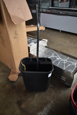 Black Poly Trash Can and Mop Handle.