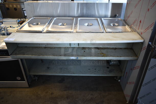 Stainless Steel Commercial Floor Style 4 Well Steam Table w/ Under Shelf on Commercial Casters.