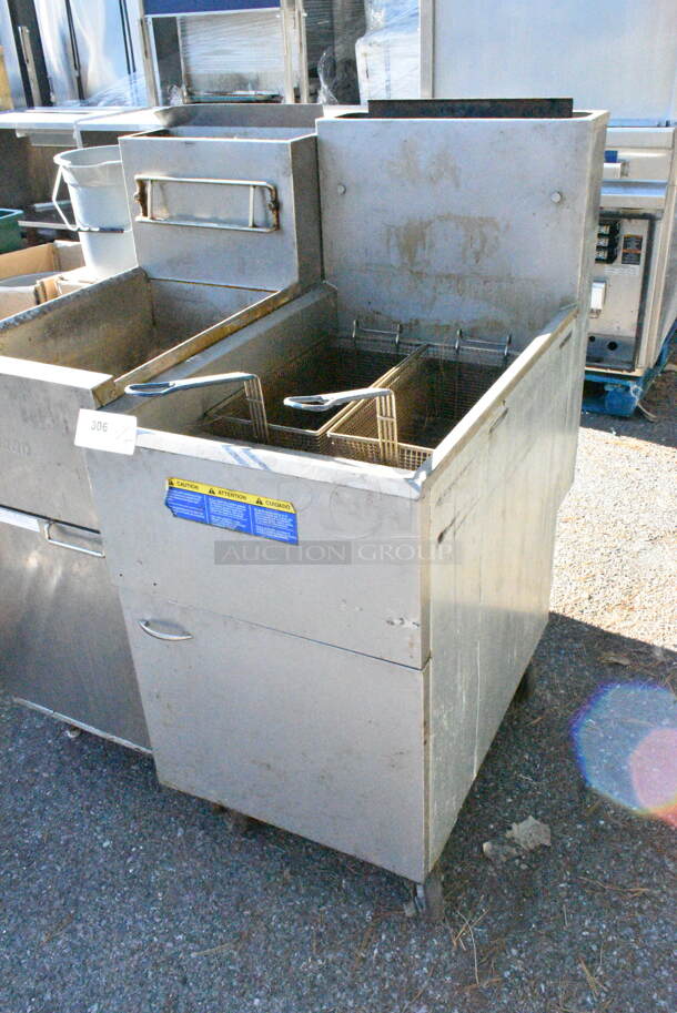 2018 Pitco Frialator 65C Stainless Steel Commercial Floor Style Natural Gas Powered 65 Pound Capacity Deep Fat Fryer w/ 2 Metal Fry Baskets on Commercial Casters. 150,000 BTU.  - Image 2 of 8