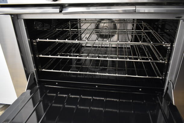 BRAND NEW SCRATCH AND DENT! 2023 Garland G36-6C Stainless Steel Commercial Floor Style Natural Gas Powered 6 Burner Range w/ Convection Oven, Over Shelf and Back Splash.  - Image 5 of 7