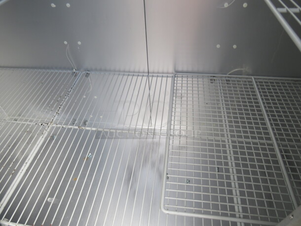 One WORKING 3 Door Stainless Steel Traulsen Refrigerator With 9 Racks, On Casters. 115 Volt. Model# G30011. 77X35X83.5. $9176.00. - Image 4 of 6
