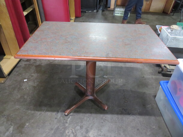 One Laminate Tabletop On A Pedestal Base. 48X28X30 - Image 1 of 2