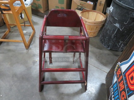 One Wooden High Chair.